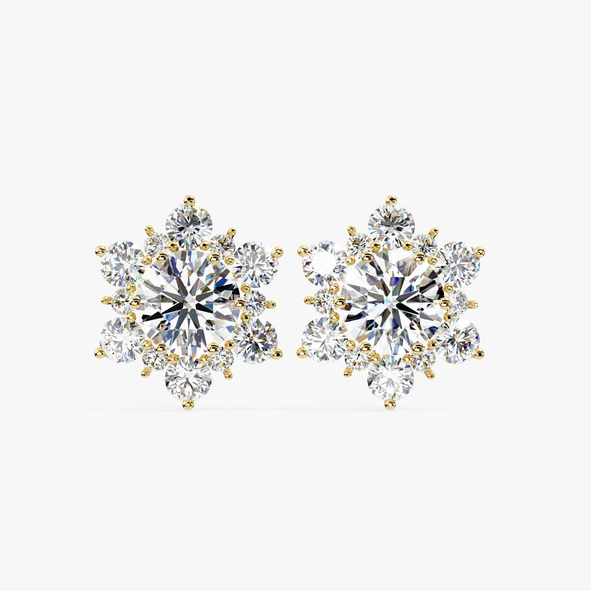 Front-facing view of the earrings highlighting their symmetrical snowflake shape and round diamonds.