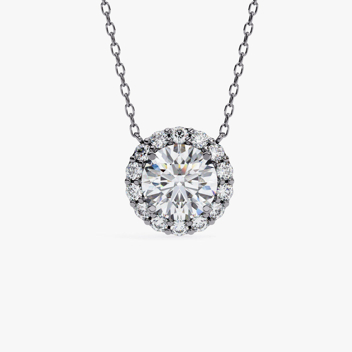 A black gold chain necklace with a round pendant featuring a single, clear, round-cut stone surrounded by a halo of smaller, clear stones.
