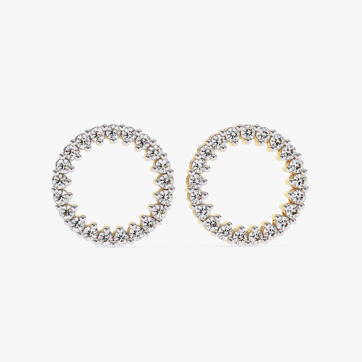 Front view of open circle studs in yellow gold with round diamonds.