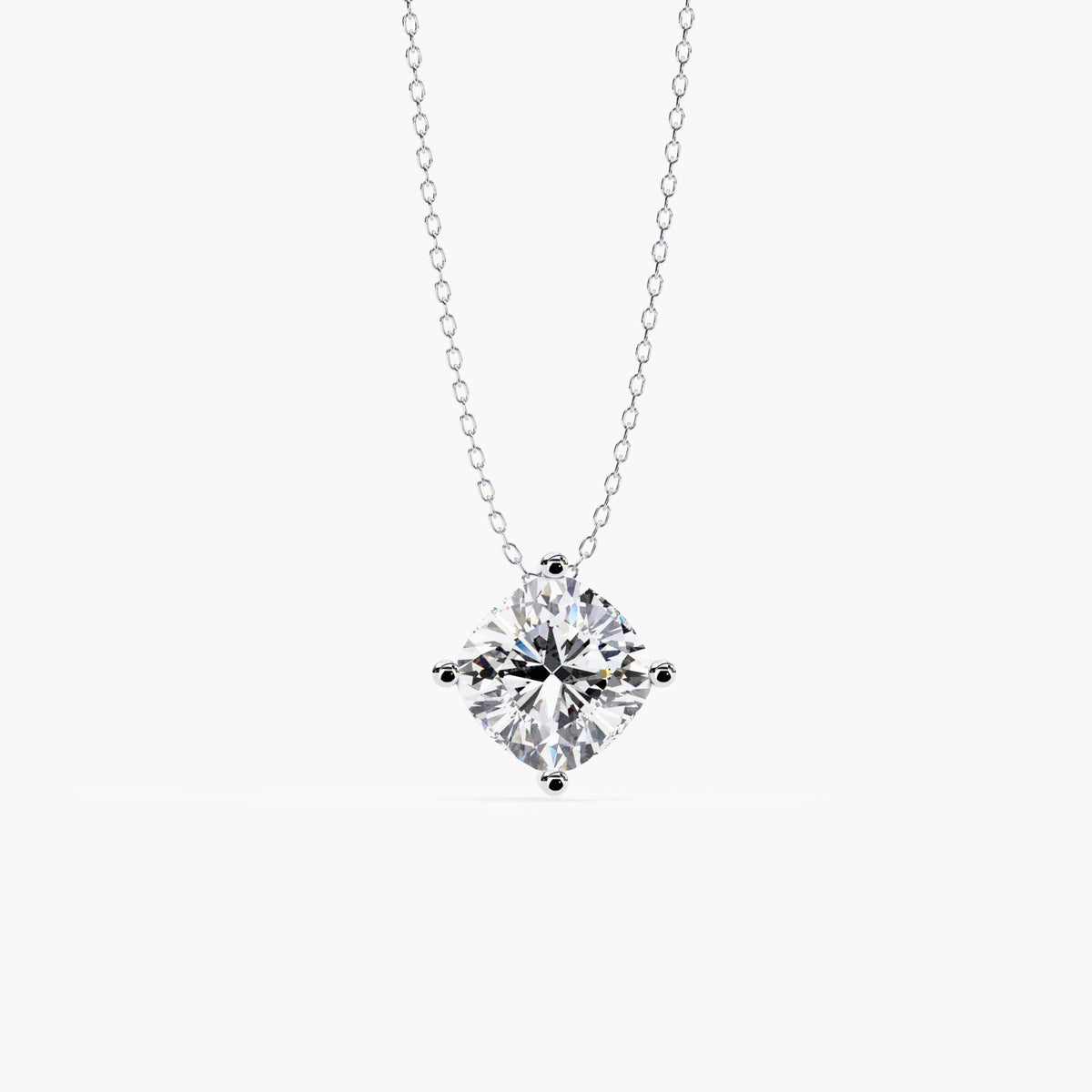 Front view of a cushion cut lab-grown diamond necklace in 14k white gold, set in a four-prong solitaire design on a delicate cable chain.