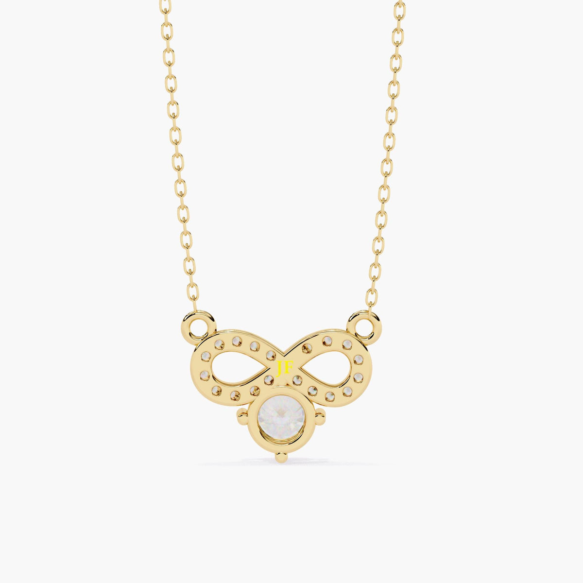 A gold infinity necklace with a diamond solitaire stone under the infinity symbol.
