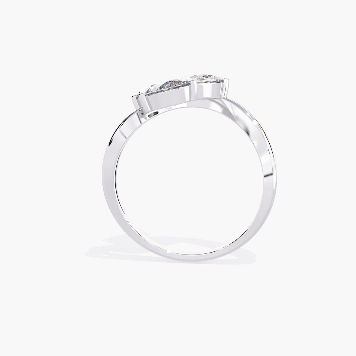A gold ring with a delicate branch design featuring clear, marquise-shaped stones.