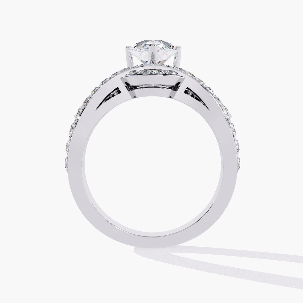 A white gold ring with a pear-shaped diamond center stone and smaller diamonds set in a crown-like design.