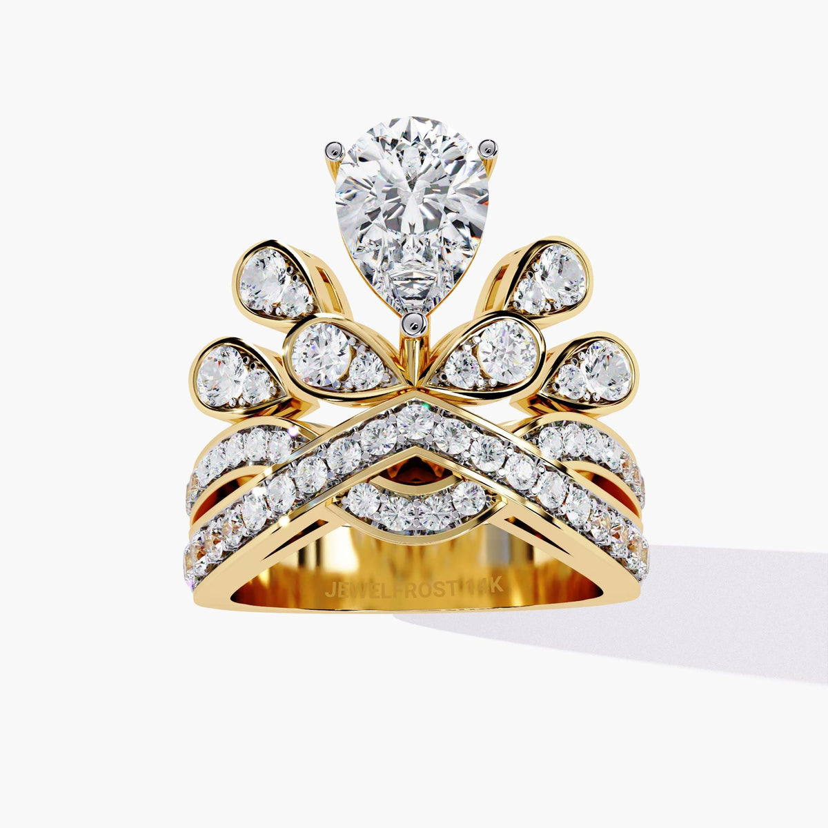 A gold ring with a pear-shaped diamond center stone and smaller diamonds set in a crown-like design.