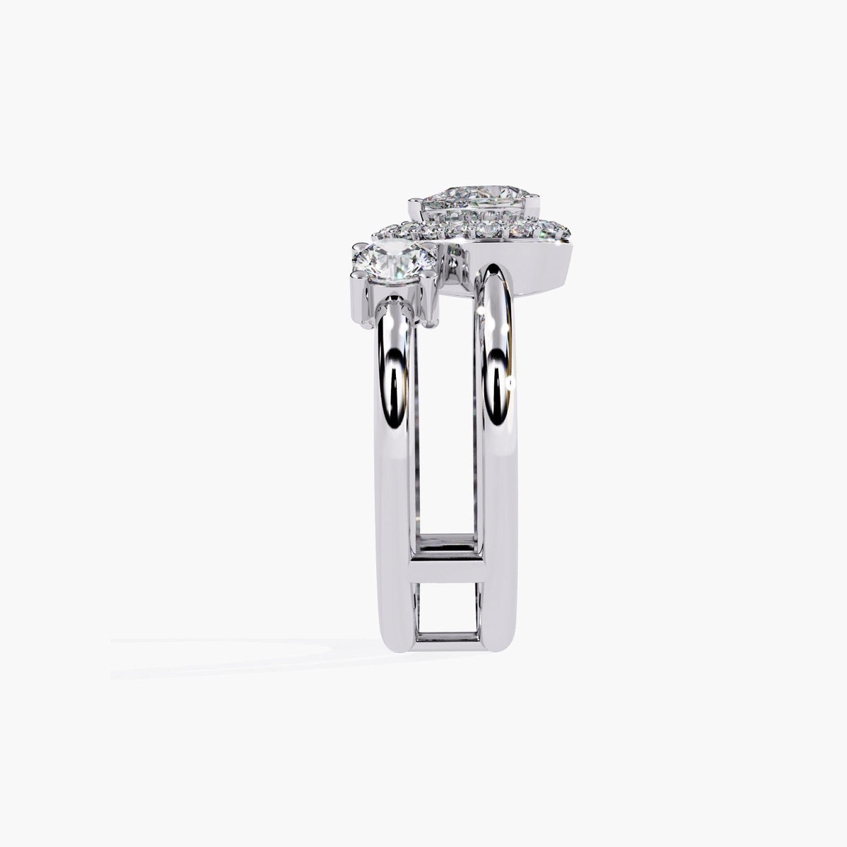 A three stone ring with a large center pear brilliant cut diamond and two smaller round brilliant cut diamonds on either side.