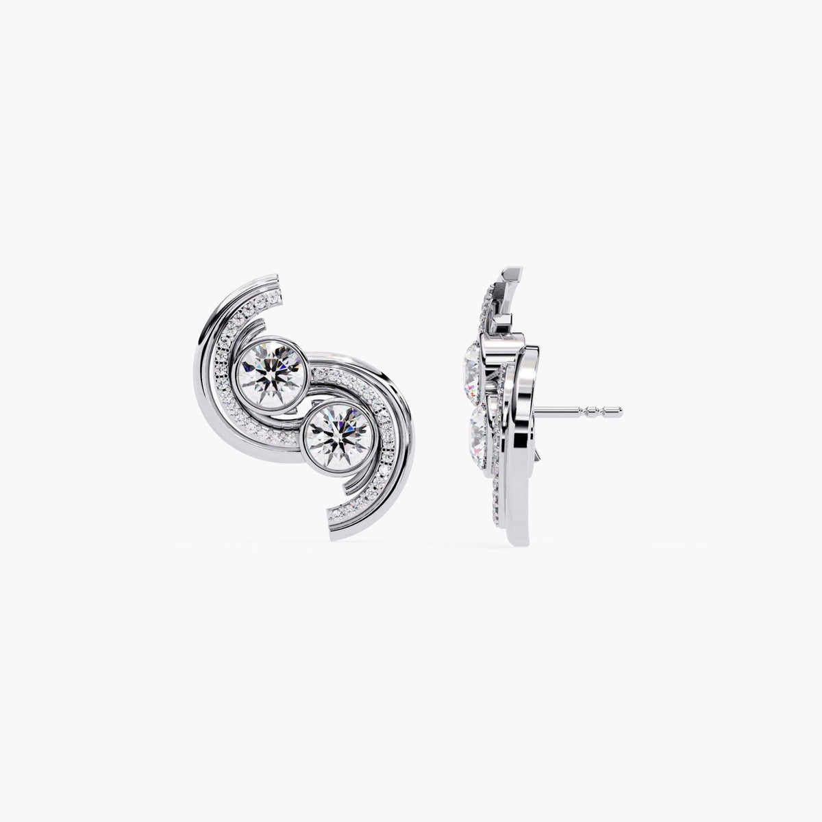 A pair of white gold earrings with a curved, asymmetrical shape and diamond stones.