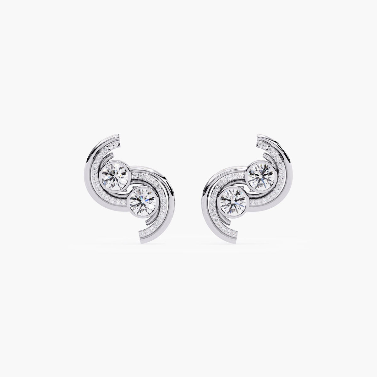 A pair of white gold earrings with a curved, asymmetrical shape and diamond stones.