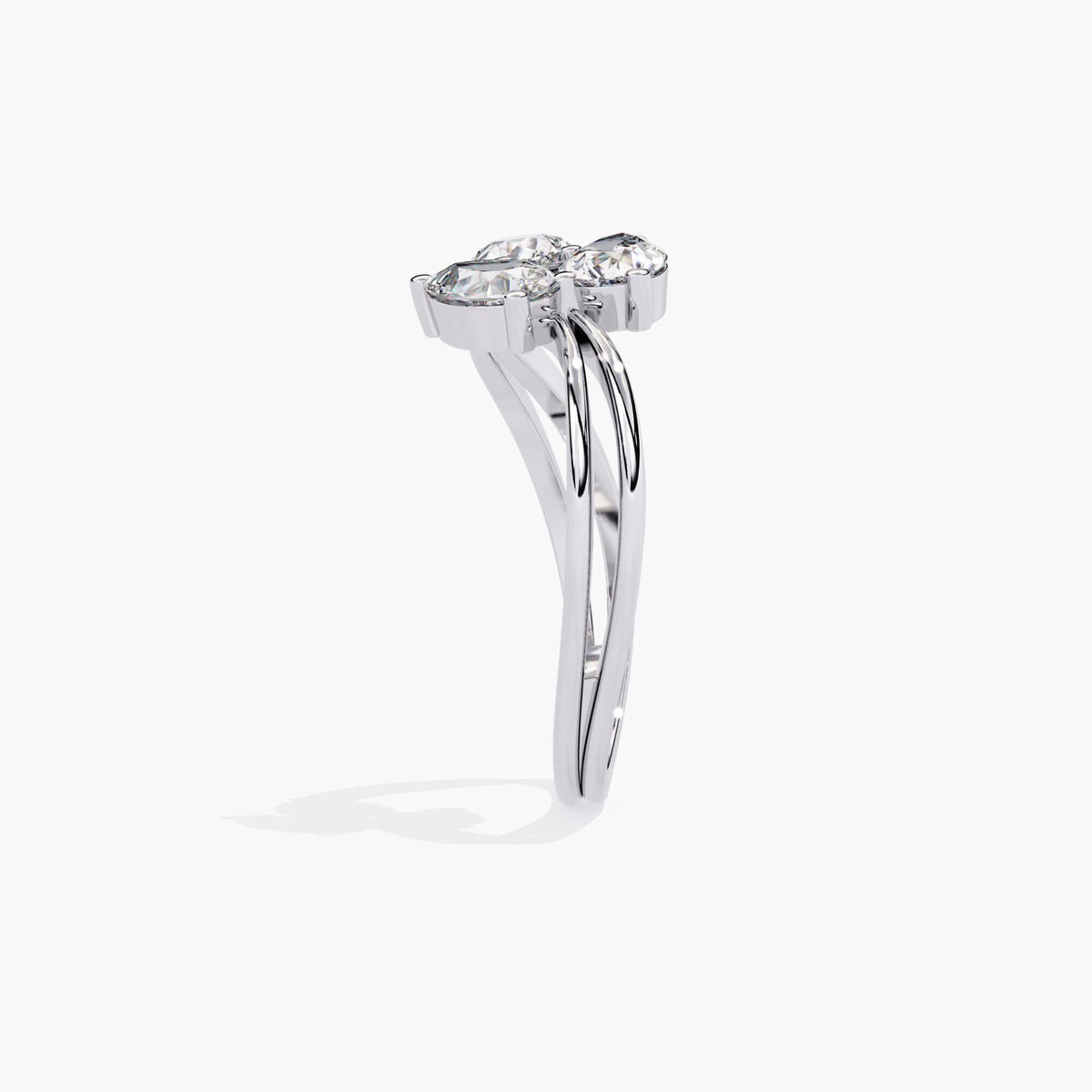 A gold ring with a delicate branch design featuring clear, marquise-shaped stones.