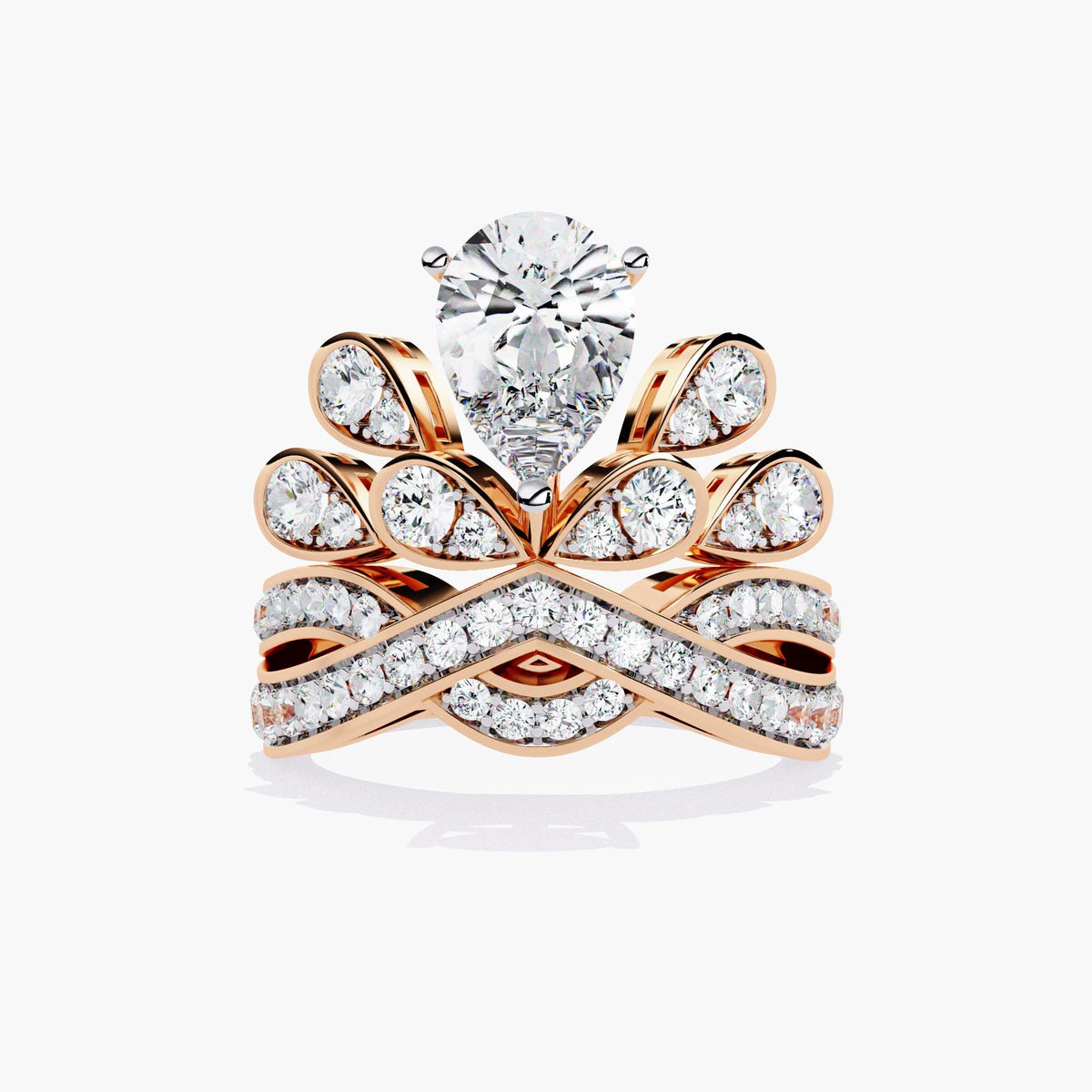 A rose gold ring with a pear-shaped diamond center stone and smaller diamonds set in a crown-like design.
