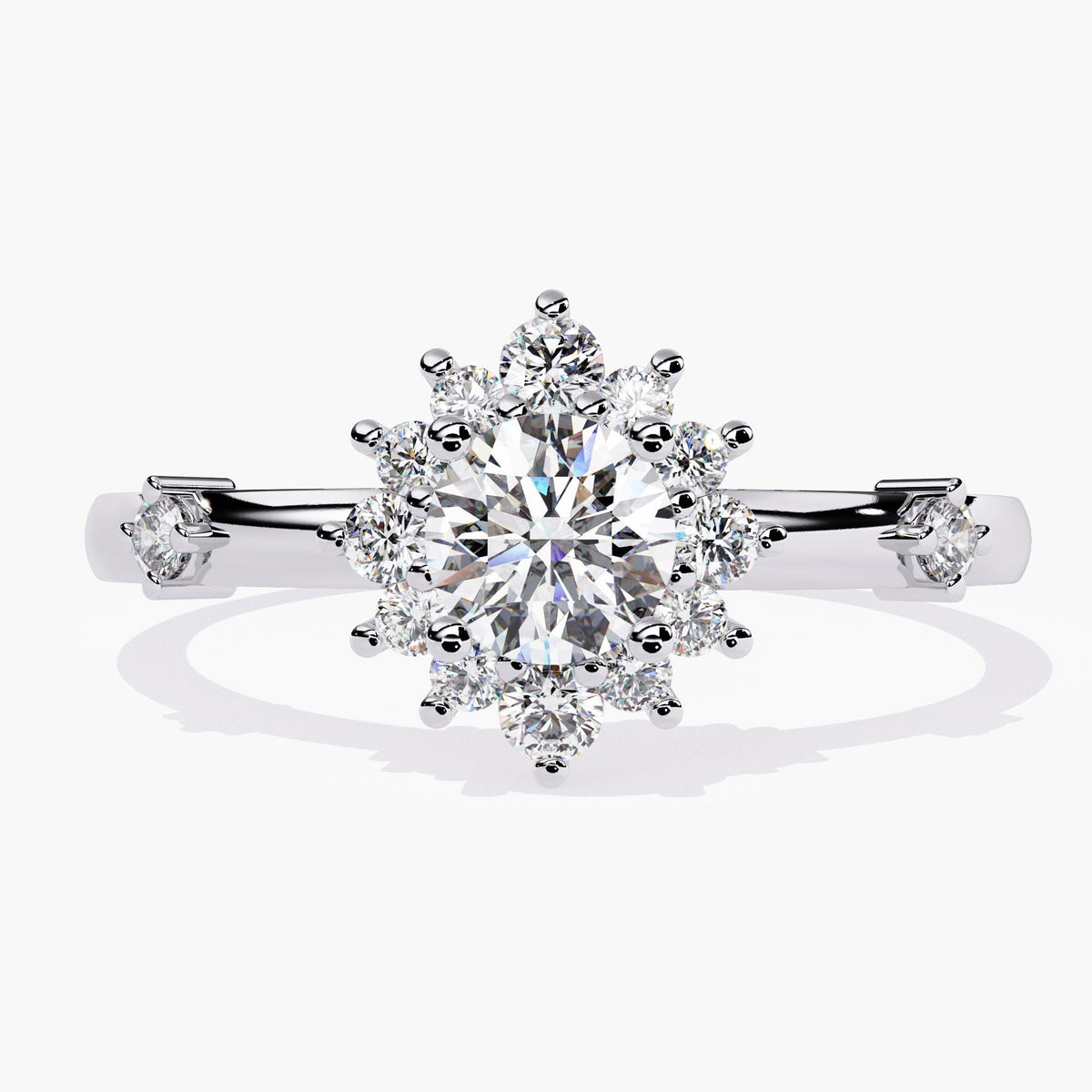 A white gold ring with a large, round, clear diamond surrounded by a halo of smaller diamonds.