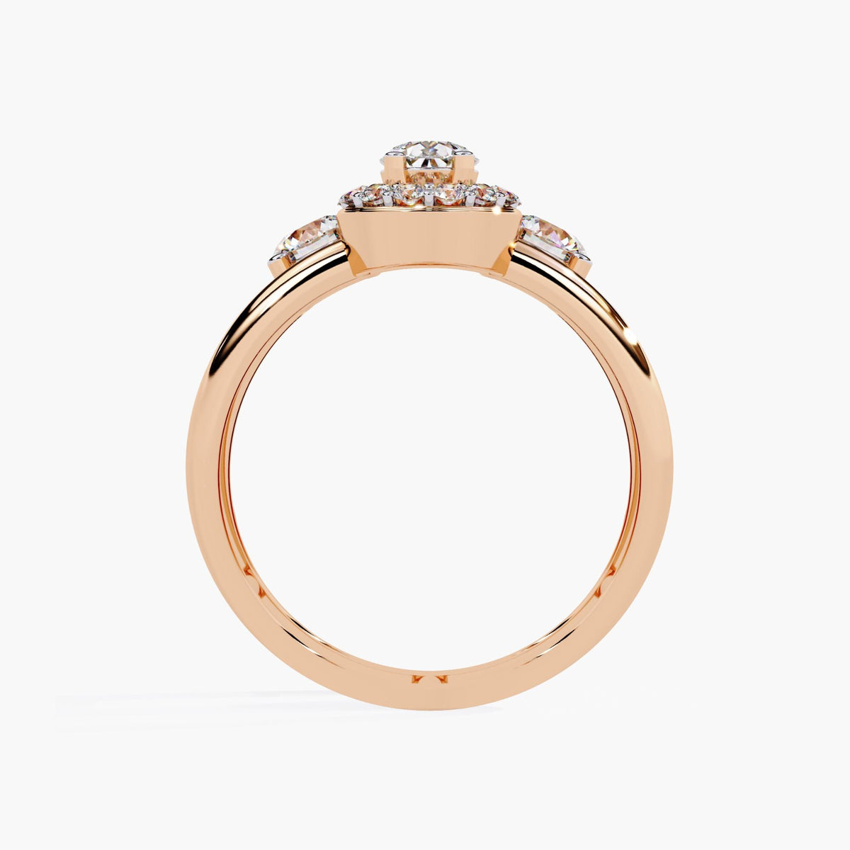 A three stone ring with a large center pear brilliant cut diamond and two smaller round brilliant cut diamonds on either side.