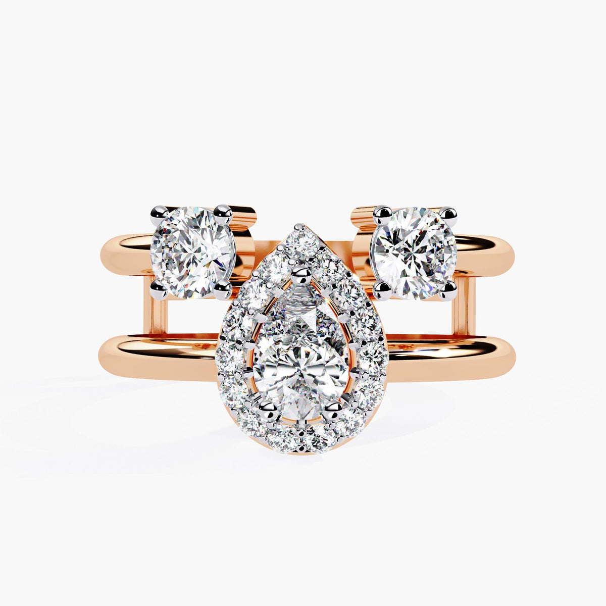A three stone ring with a large center pear brilliant cut diamond and two smaller round brilliant cut diamonds on either side.