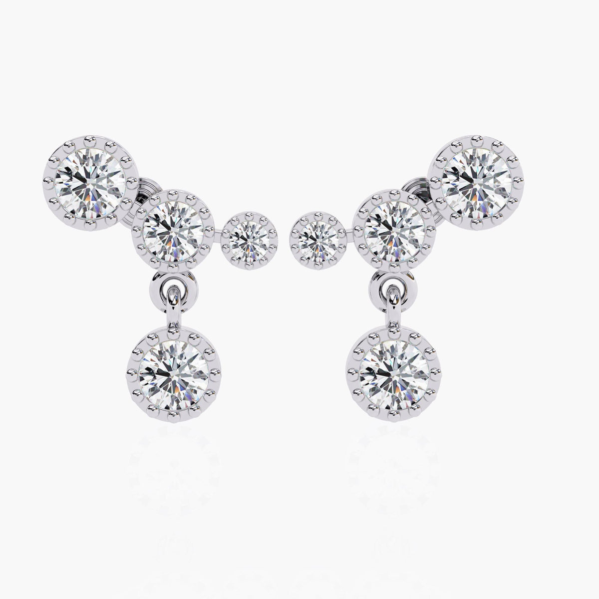 A white gold diamond ear climber earrings with a drop down round shaped diamond.
