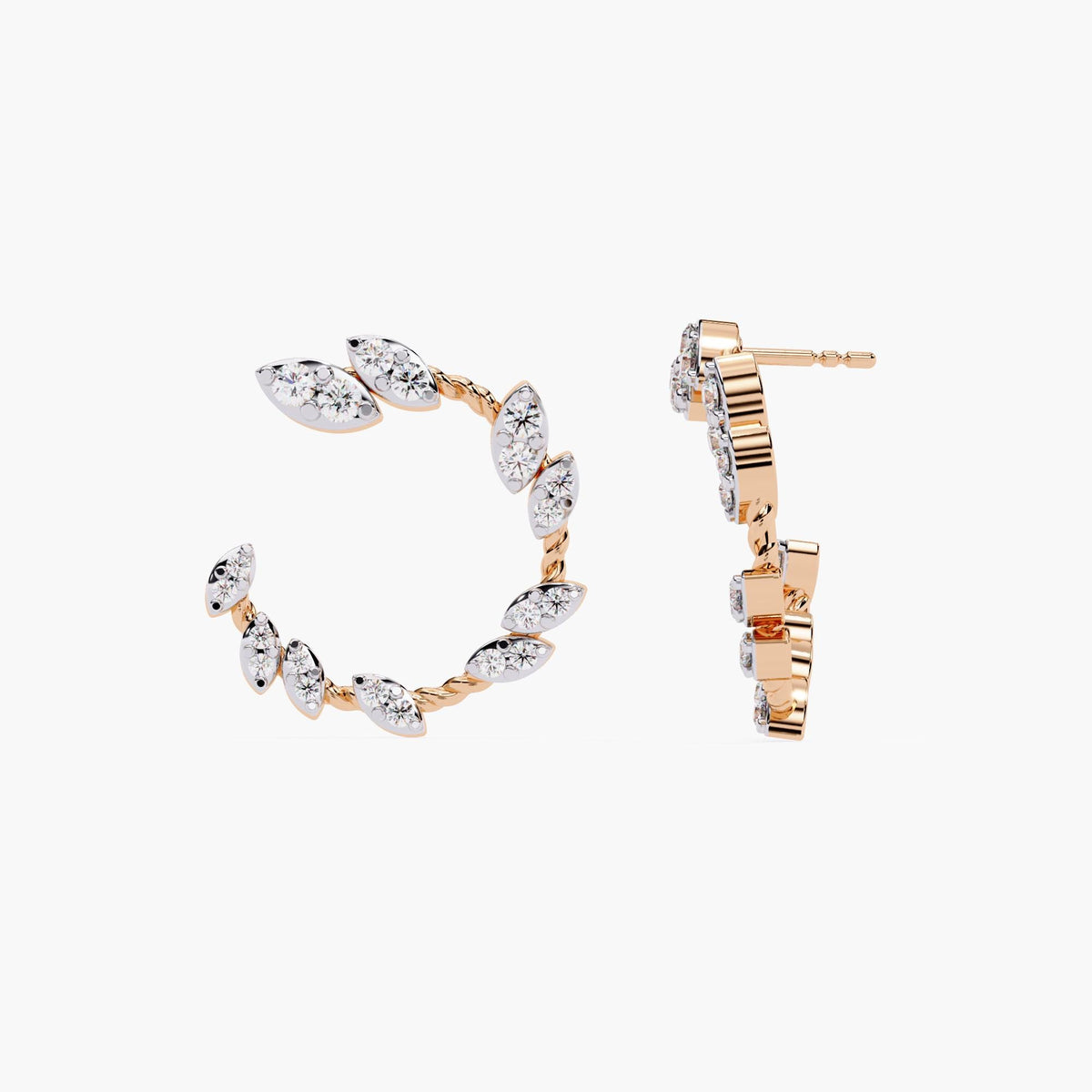 A pair of rose gold earrings with marquise cut diamonds.