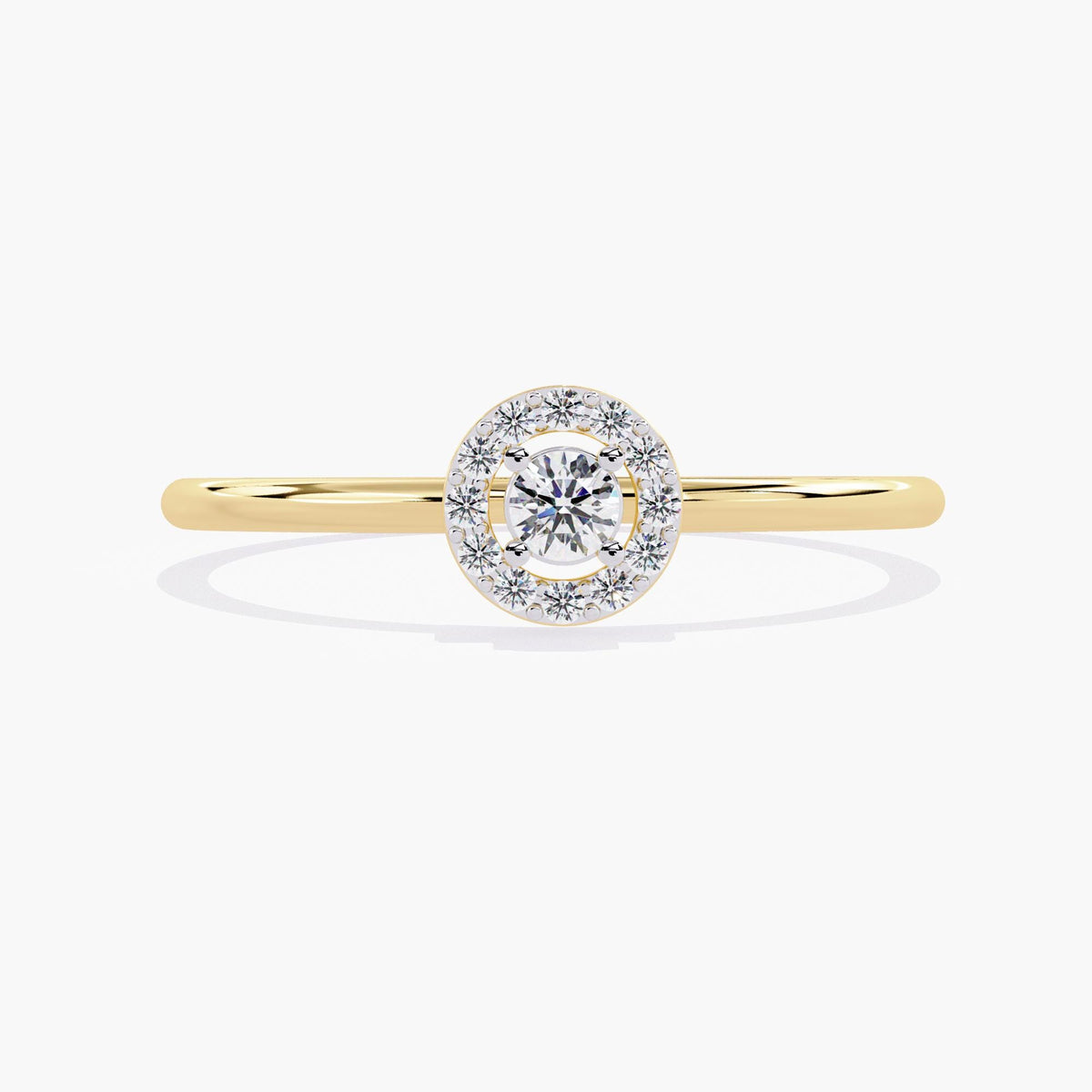 A yellow gold band ring with a single round diamond set in a halo of smaller diamonds.