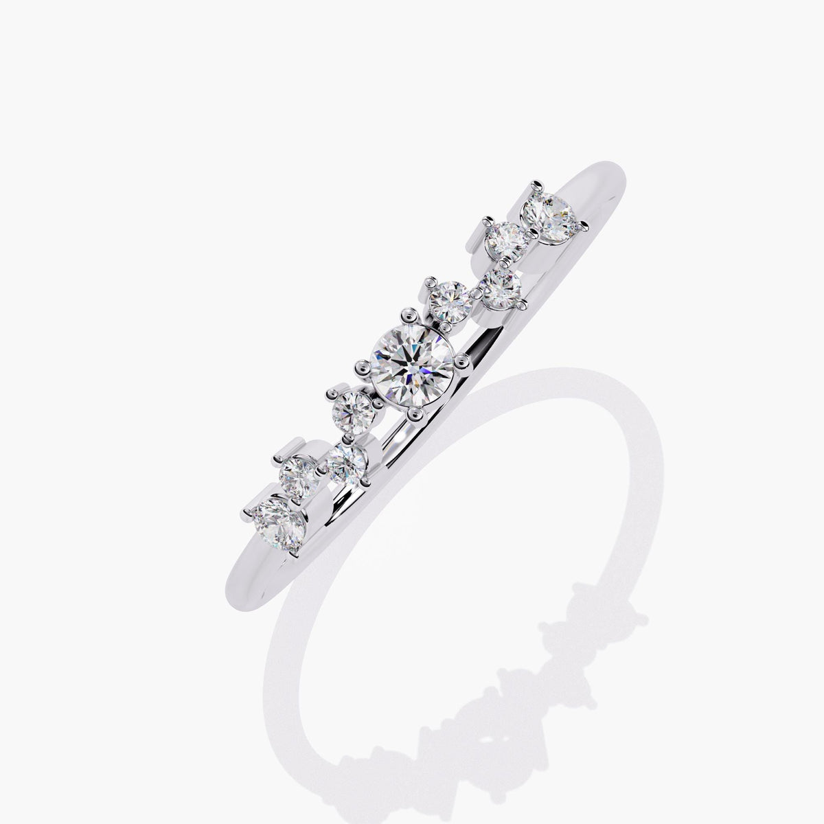 A white gold band ring with a cluster of small diamonds and a larger round diamond in the center.