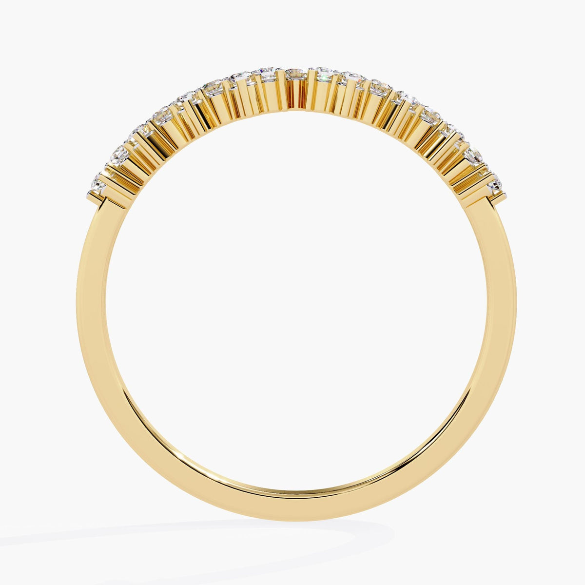 A yellow gold ring with a row of round diamonds set in a delicate band.