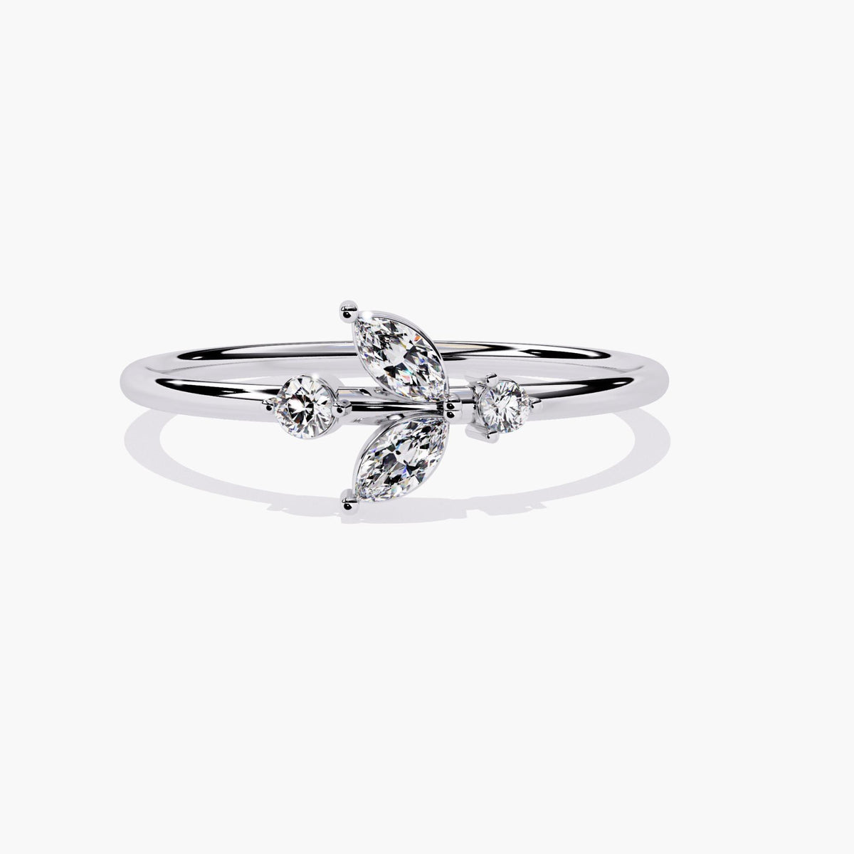 A white gold ring with a delicate leaf design featuring marquise-shaped diamonds and two round diamonds.