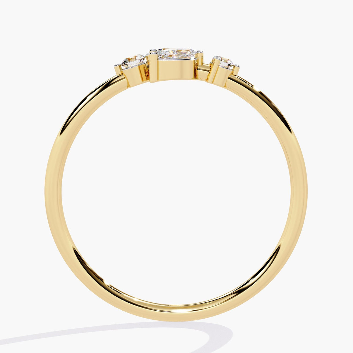 A yellow gold ring with a delicate leaf design featuring marquise-shaped diamonds and two round diamonds.