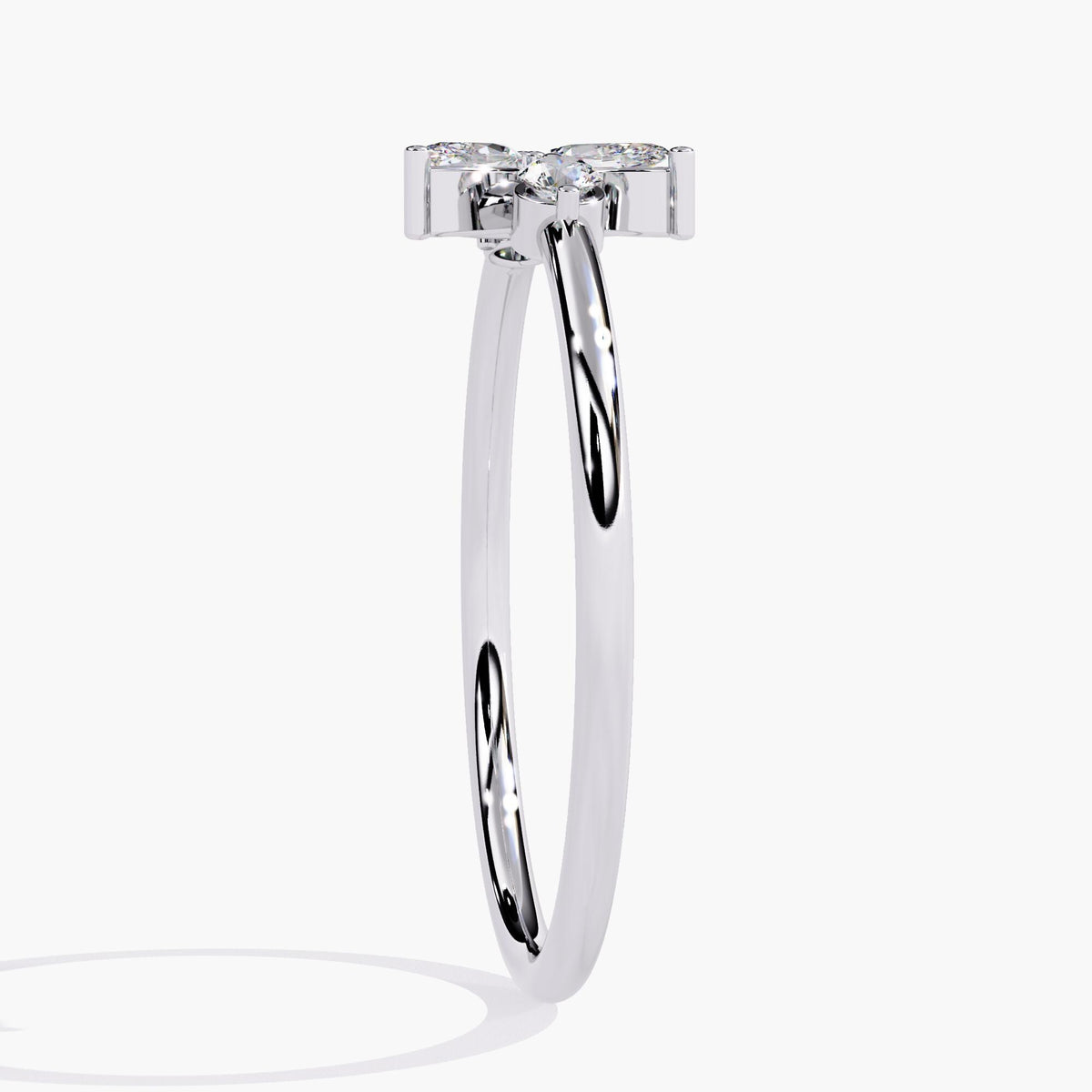 A white gold ring with a delicate leaf design featuring marquise-shaped diamonds and two round diamonds.