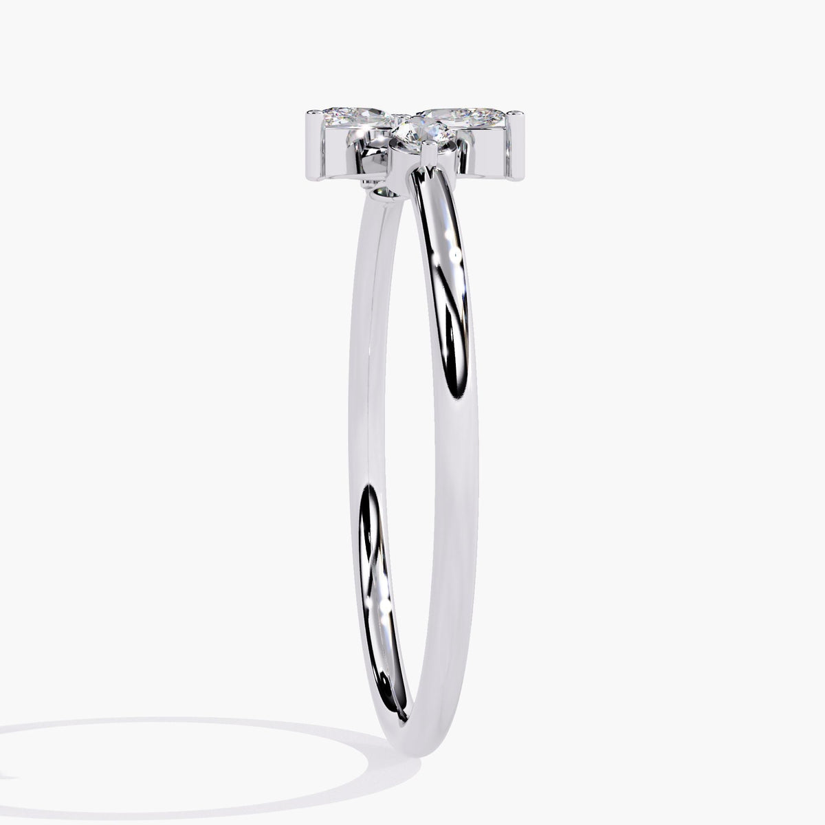 A white gold ring with a delicate leaf design featuring marquise-shaped diamonds and two round diamonds.
