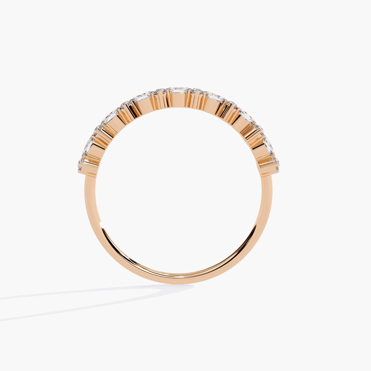 Back view of a 14k rose gold diamond ring showing the half eternity arc of east-west marquise and round diamonds in shared prong settings