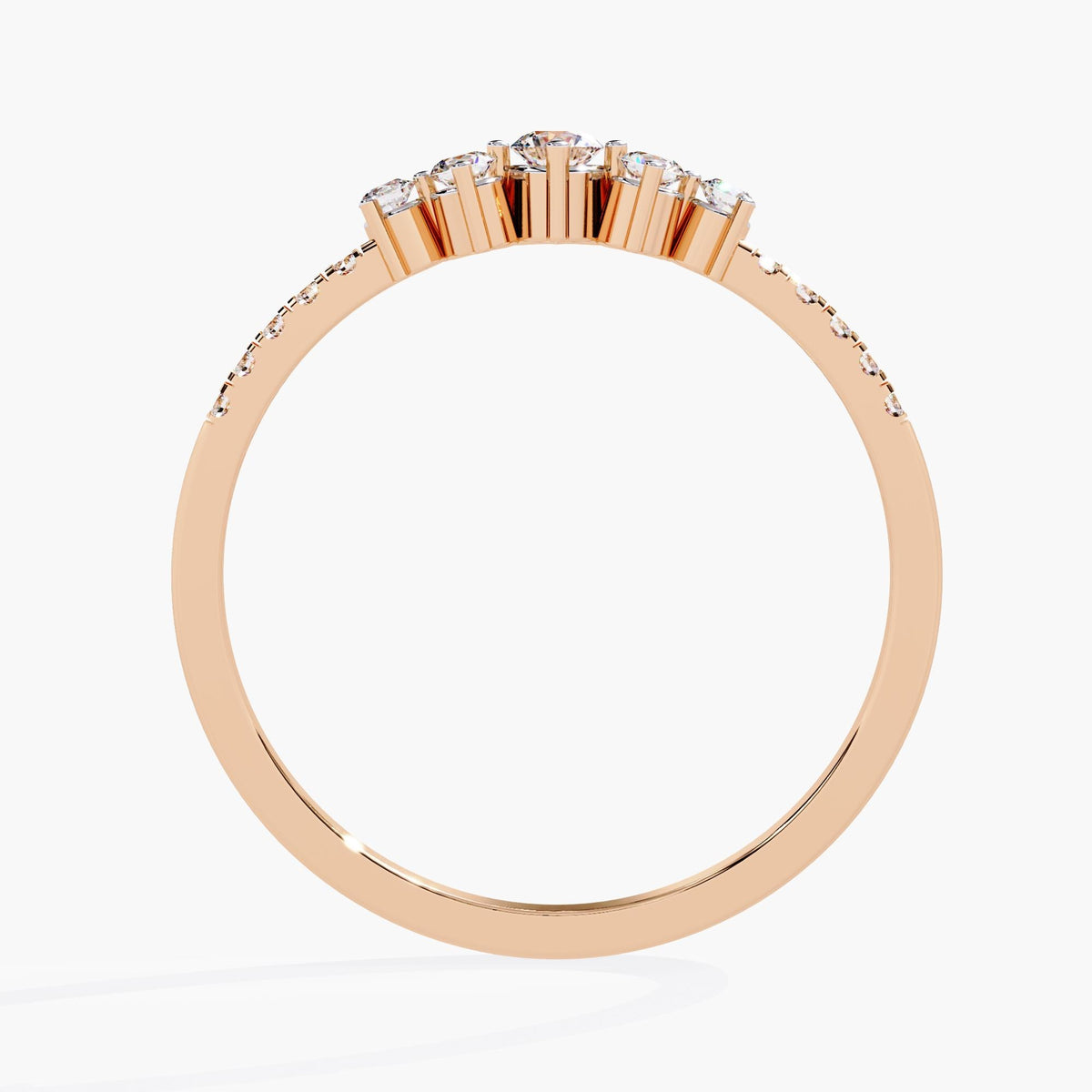A rose gold band ring with a row of small diamonds and five larger diamonds in the center.