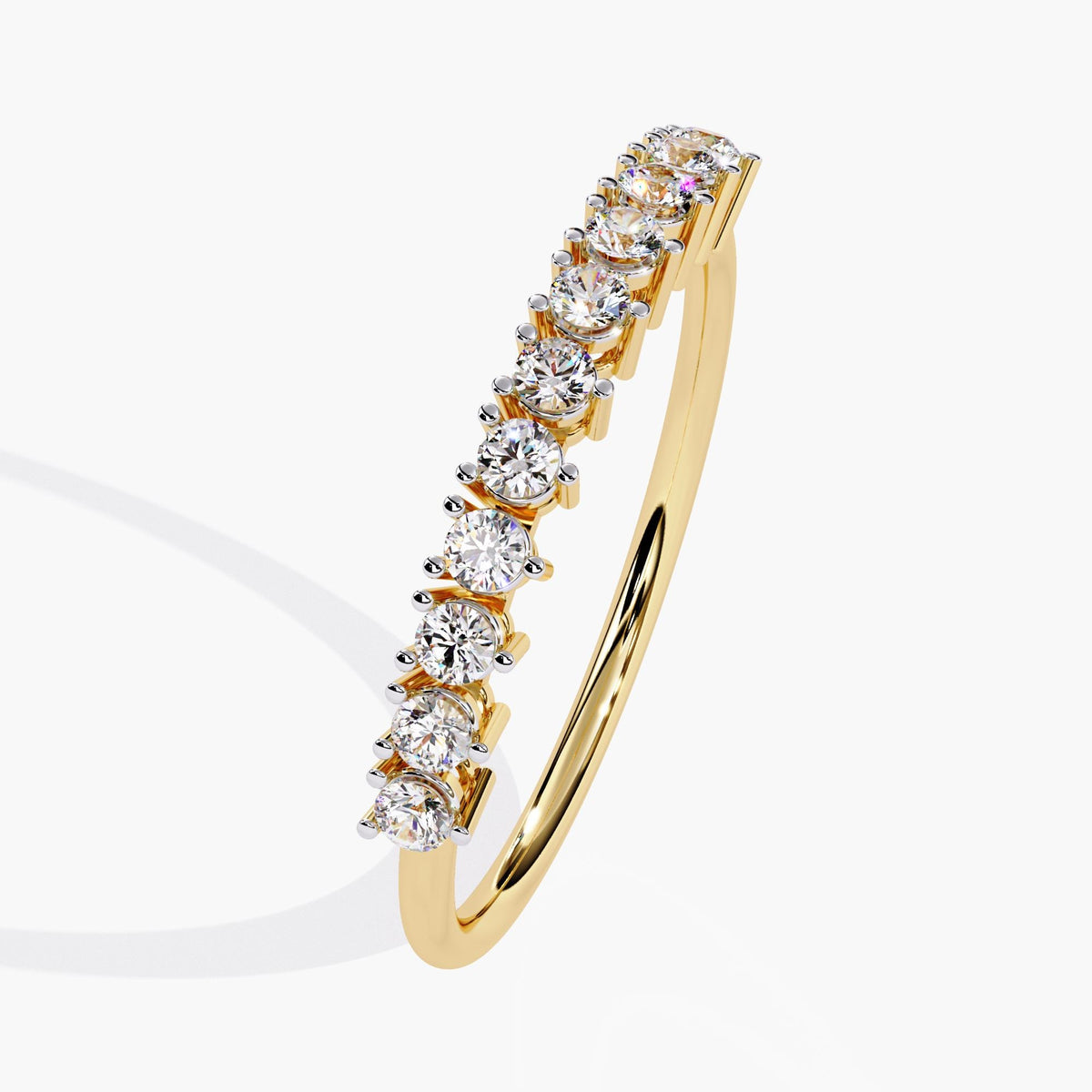 A yellow gold half eternity band with a row of small, round, clear diamonds.
