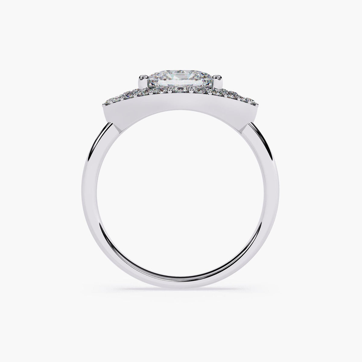 A white gold engagement ring with a marquise cut diamond center stone and a halo of smaller diamonds.