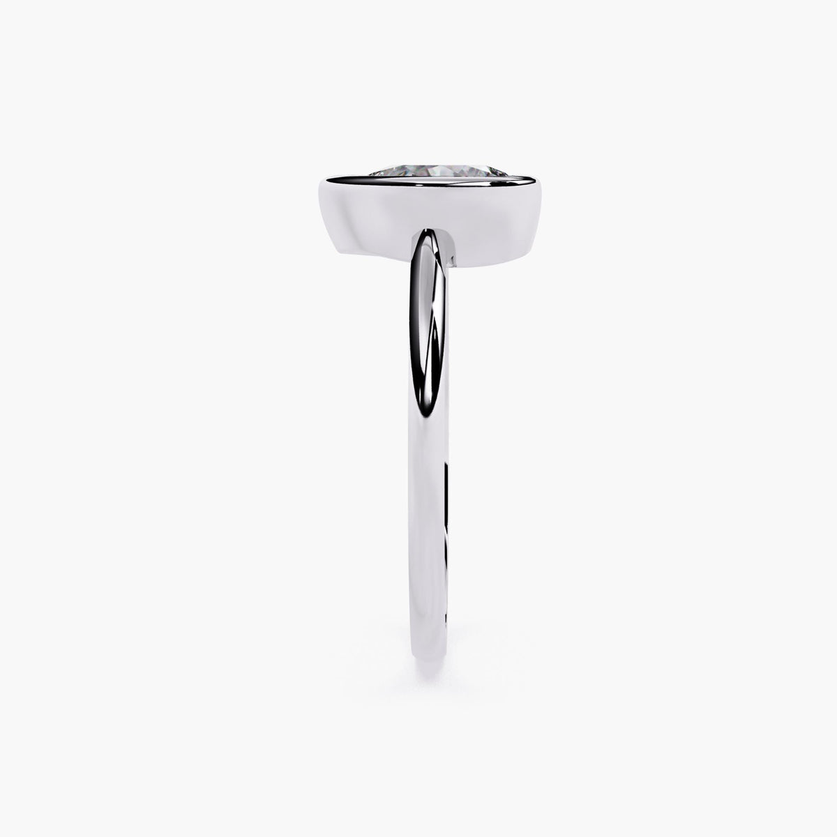 A white gold ring with pear cut diamond at the center.