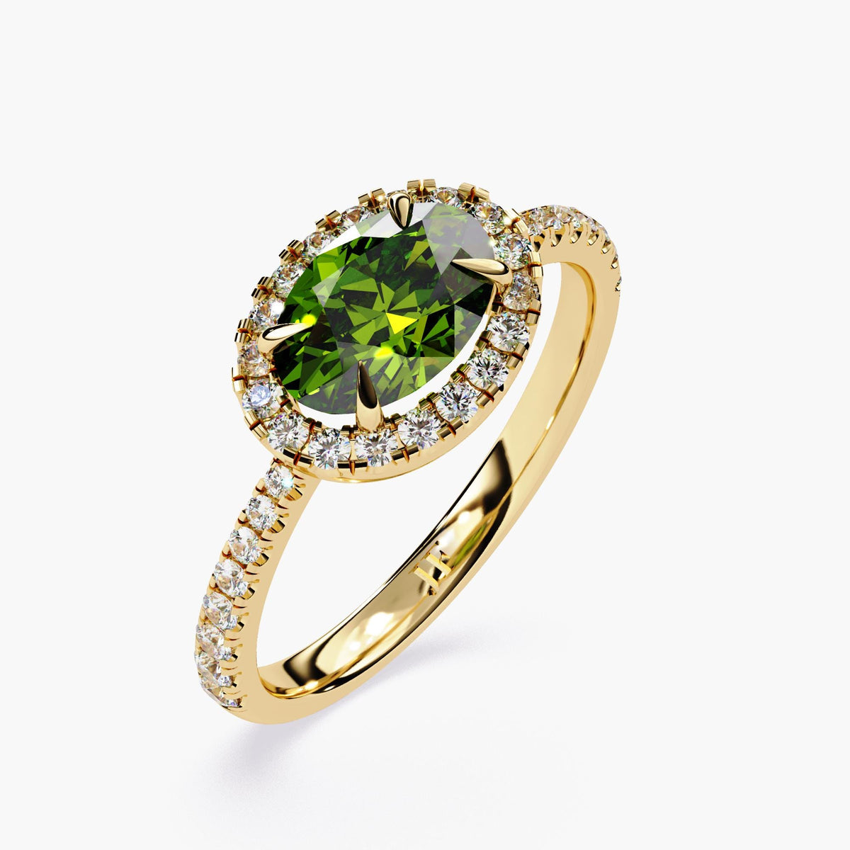 Oval cut emerald ring with diamonds surrounding the gemstone.