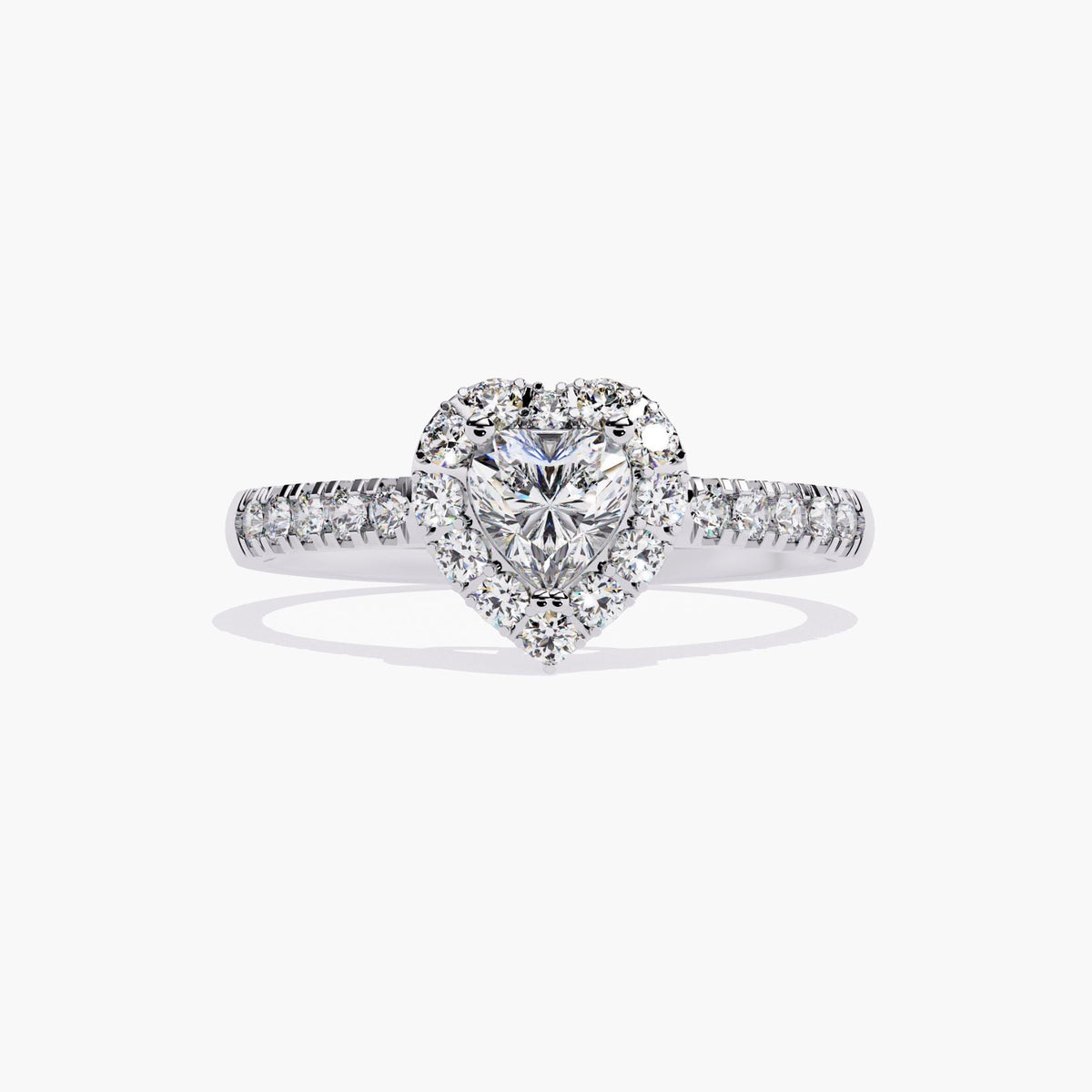 A heart-shaped diamond engagement ring with a halo setting and a white gold band. the band has pave diamond accent