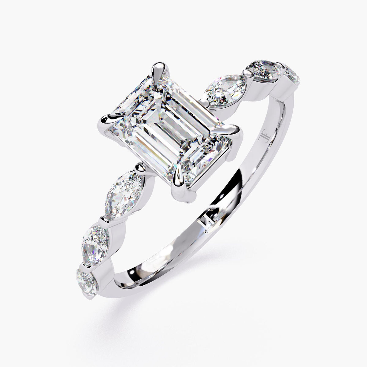 A gold emerald-cut moissanite engagement ring. The ring features a large, radiant emerald-cut moissanite center stone.