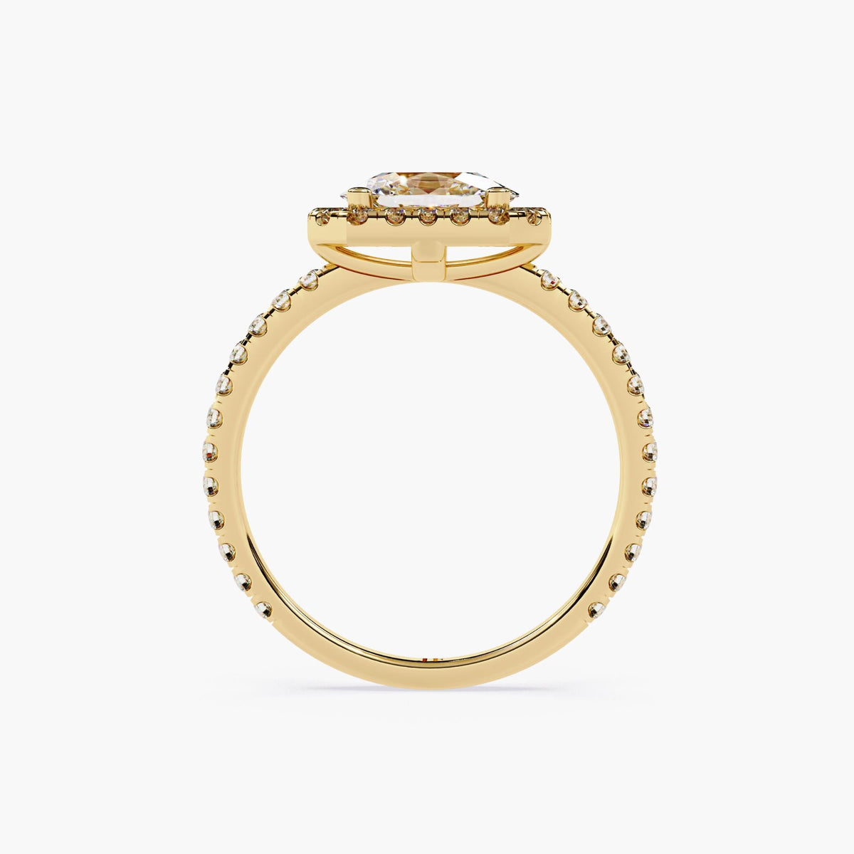 A gold ring with an oval cut diamond center stone surrounded by a halo of smaller diamonds.