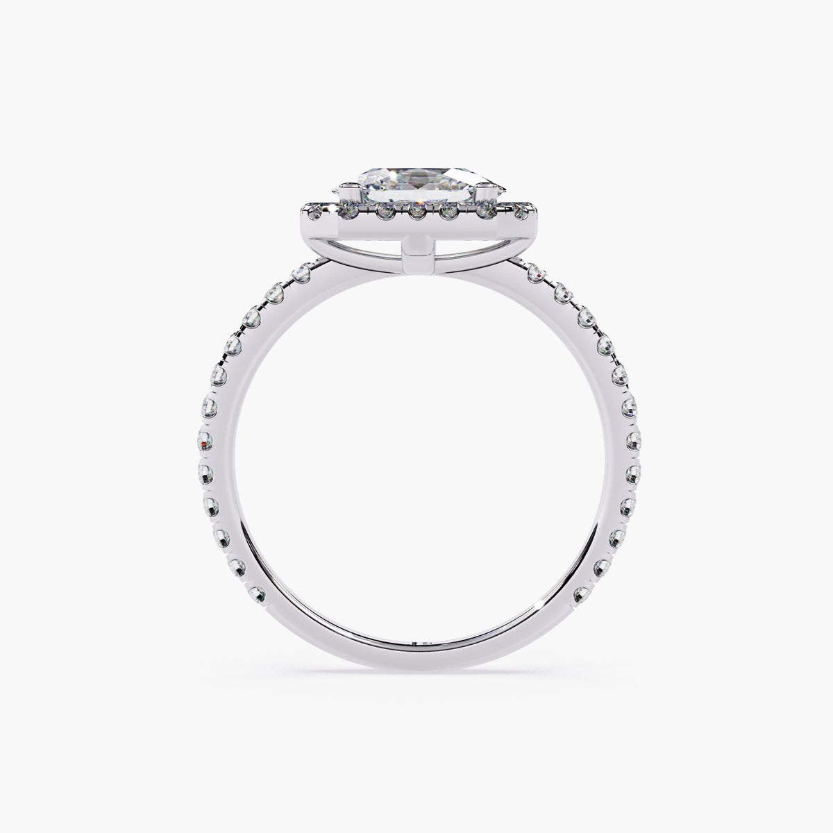 A white gold ring with an oval cut diamond center stone surrounded by a halo of smaller diamonds.