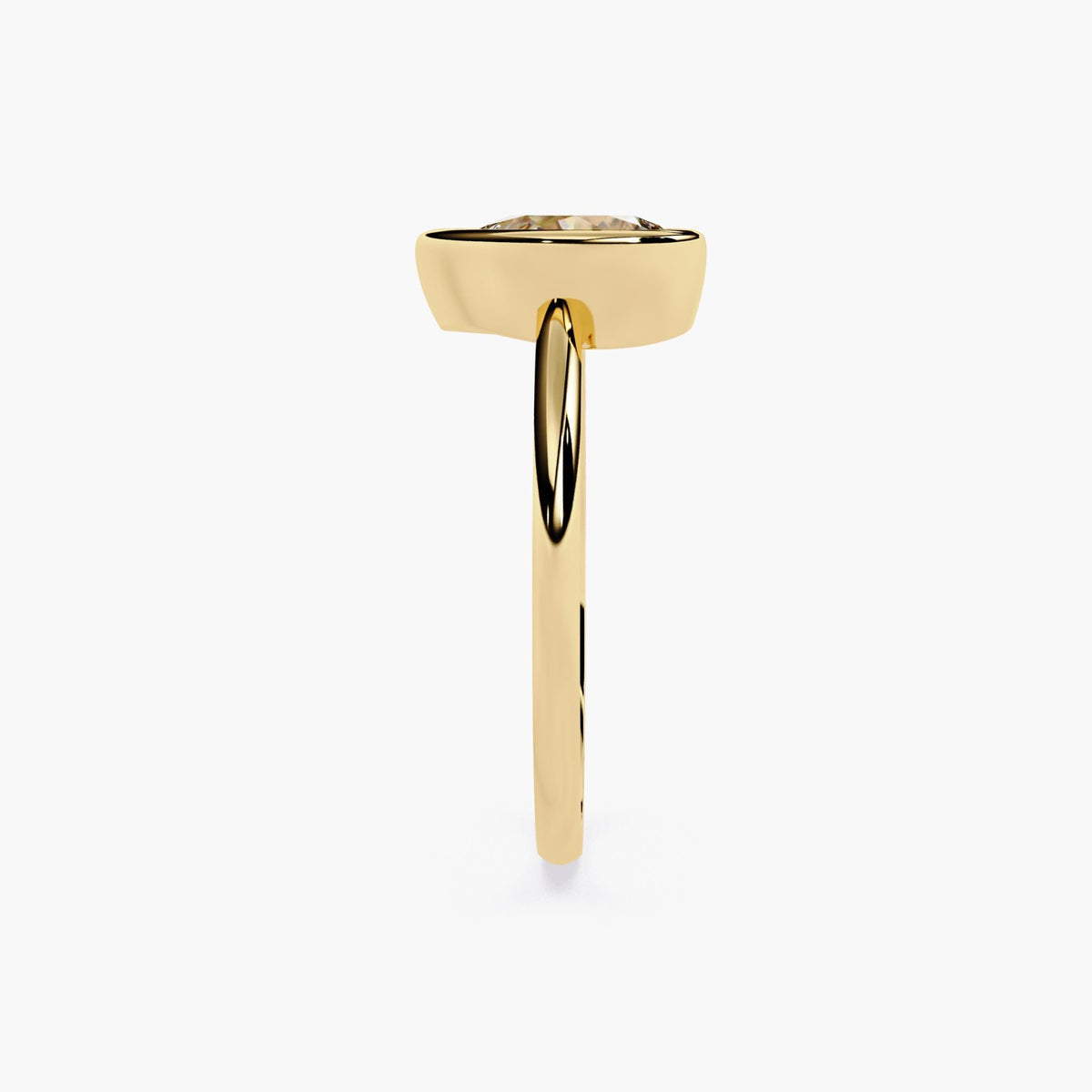 A gold ring with pear cut diamond at the center.