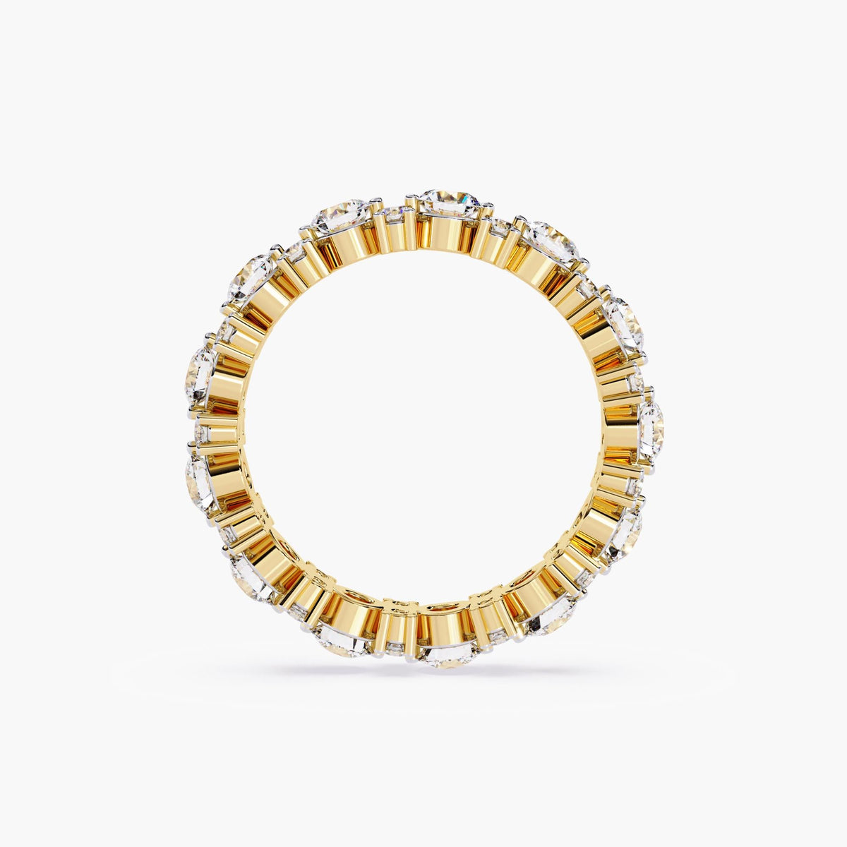 A gold full eternity ring with round cut diamonds in different sizes.