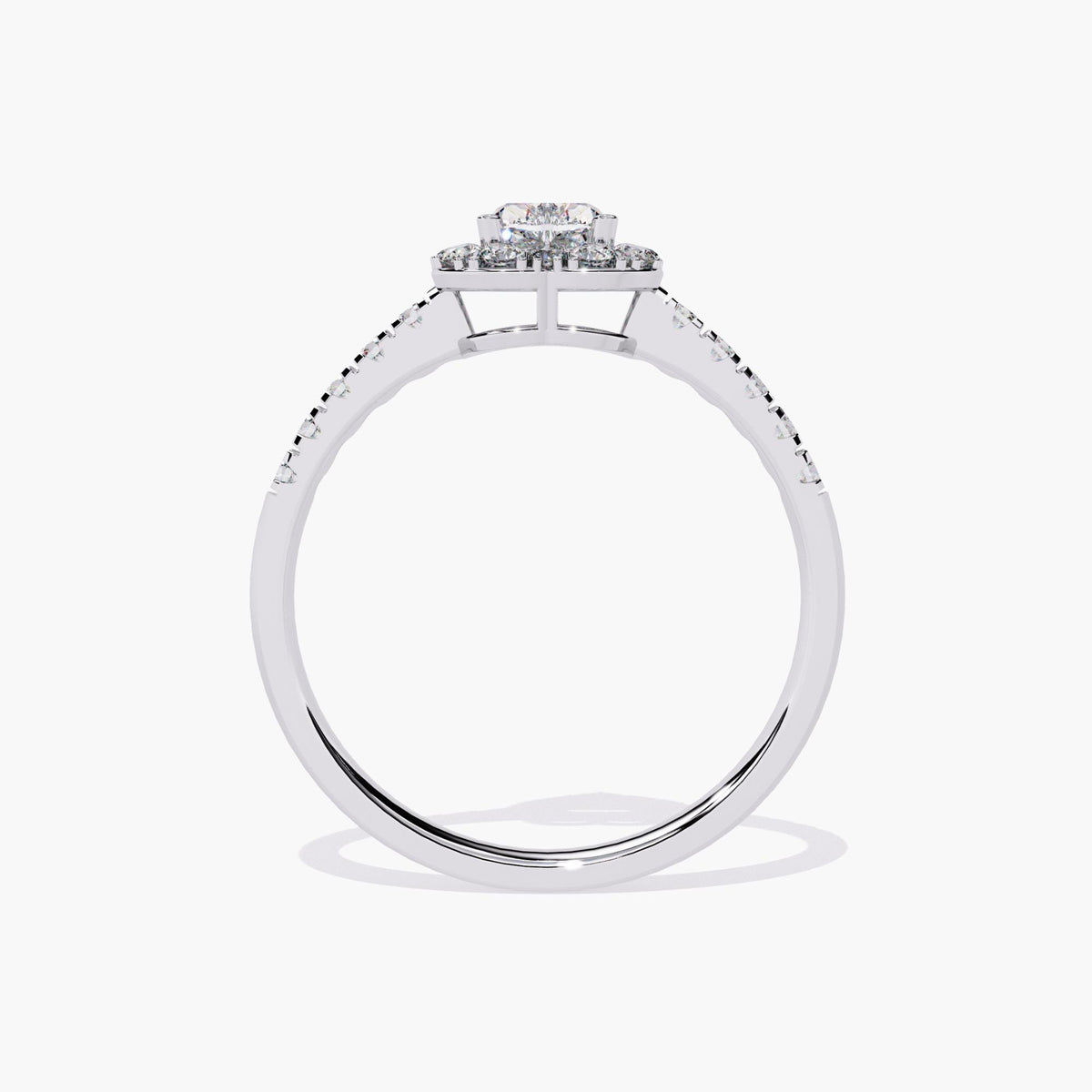 A heart-shaped diamond engagement ring with a halo setting and a white gold band.