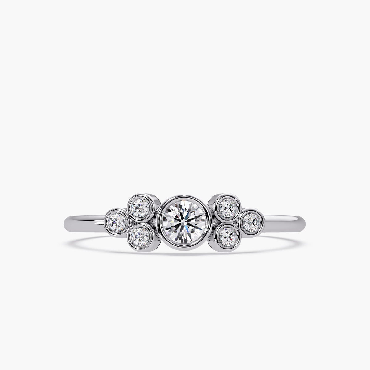 This bubble ring is a true statement piece! Crafted in 14K solid gold, it features a stunning arrangement of seven round brilliant diamonds in a playful, bezel-set design. Its polished finish and dainty band make it ideal for everyday wear, while still packing all the sparkle and charm you could ask for.