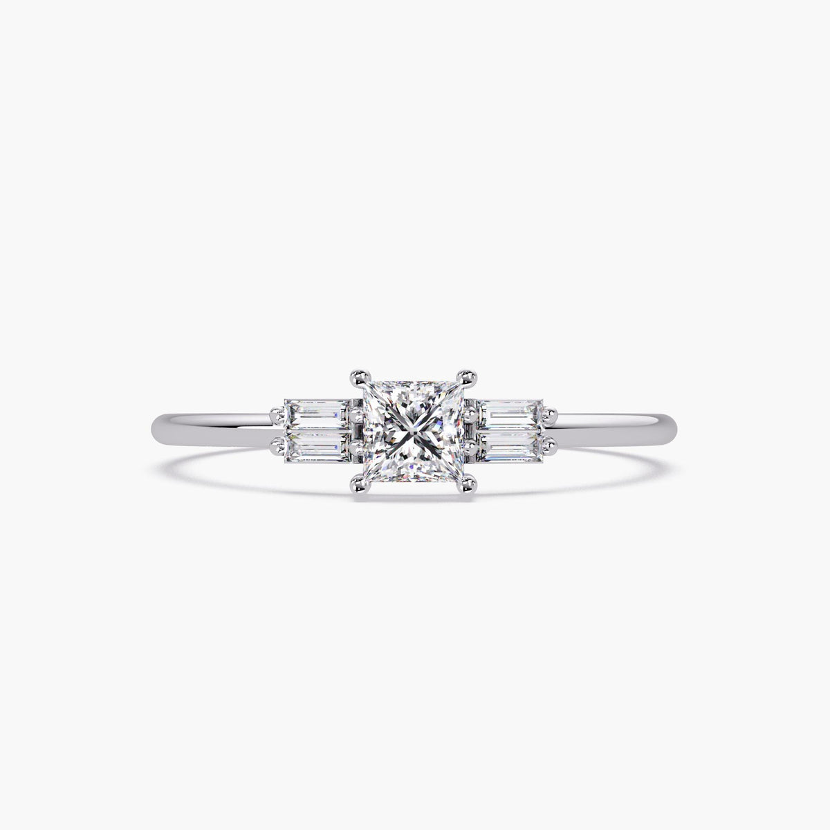 white gold ring with princess cut center diamond and baguette diamond accents, on a white background.