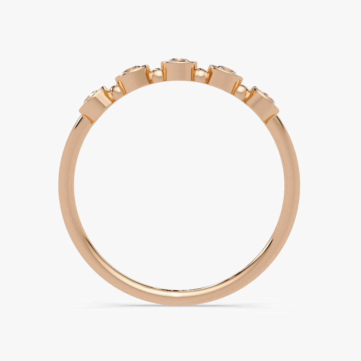 A side view of 14K rose gold band featuring five bezel-set round diamonds. The diamonds are arranged evenly along the band