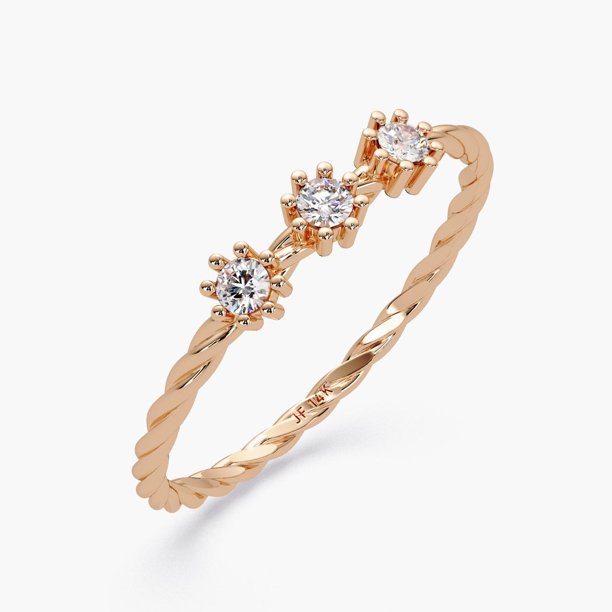 Angled view of a 14k rose gold twisted band ring with three round natural diamonds in six-prong floral settings, showing the engraved 14k mark inside the band.