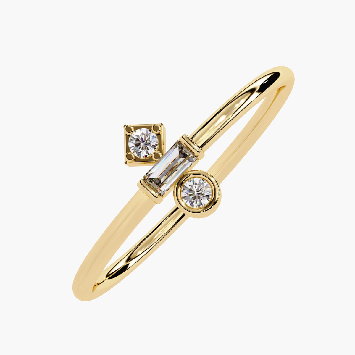 Angled view of a 14k yellow gold ring featuring three lab-grown diamonds in distinct settings—a square-set round diamond, a horizontal baguette, and a bezel-set round diamond. The open arrangement and polished band give the ring a modern, asymmetric look suited for minimalist stacking or everyday wear.