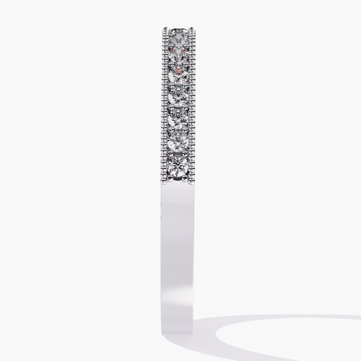 Side view of a 14k white gold ring with a flat profile, featuring a row of round lab-grown diamonds set in a single pave line with milgrain borders. The flat edge makes it easy to pair with other geometric bands or wear alone as a statement stacking piece.