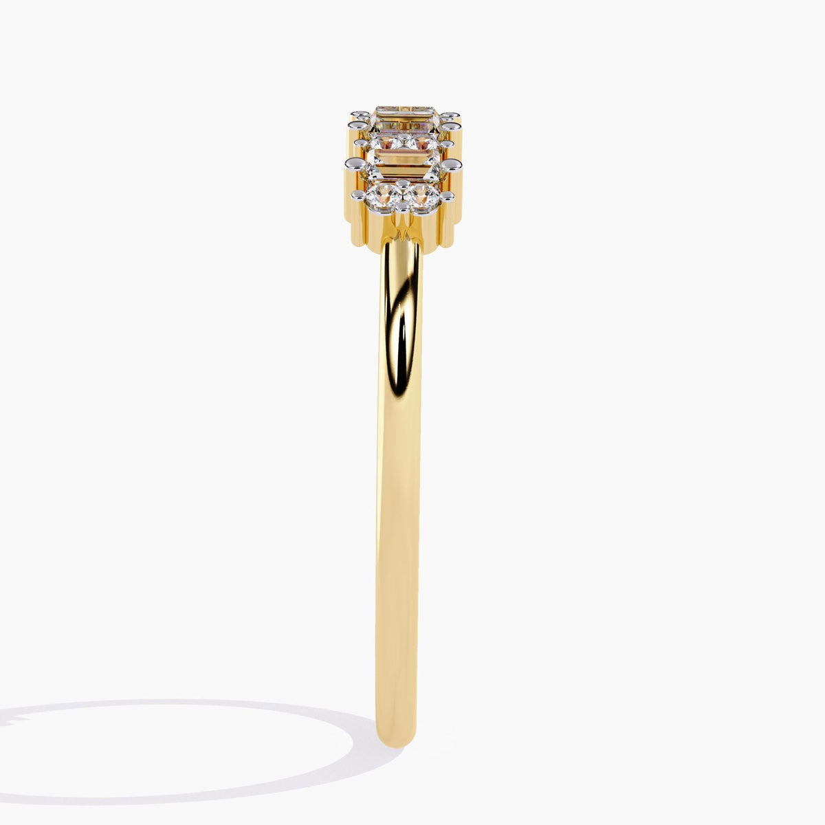 Side view of a 14k yellow gold ring showcasing a row of vertically set baguette and round diamonds in an alternating pattern. The slim polished band tapers gently beneath the diamond cluster.