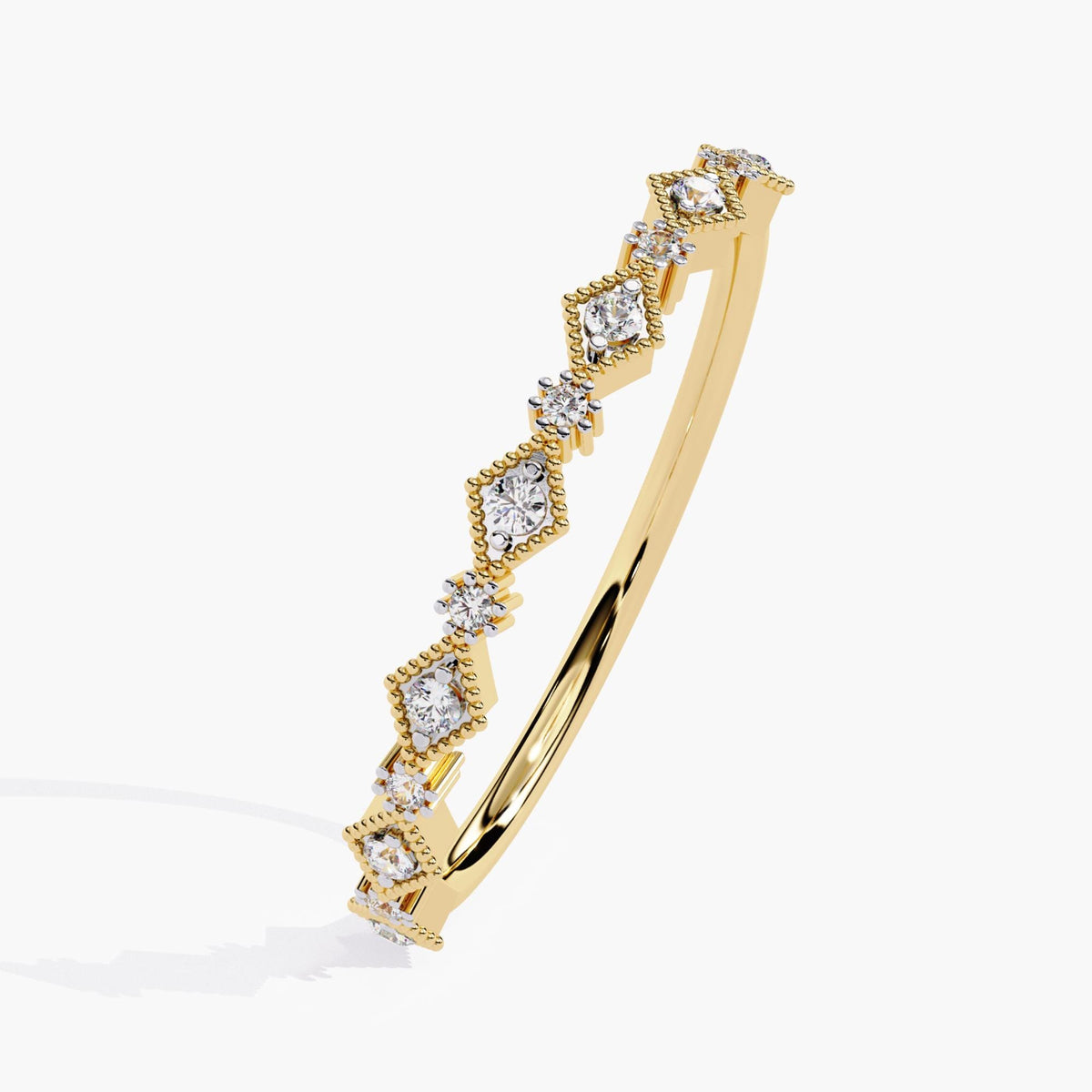 Side angle of a 14k gold half eternity diamond ring featuring lab-grown round diamonds in alternating prong and milgrain marquise settings. The Art Deco stacking band curves to show its dainty profile and vintage-inspired design