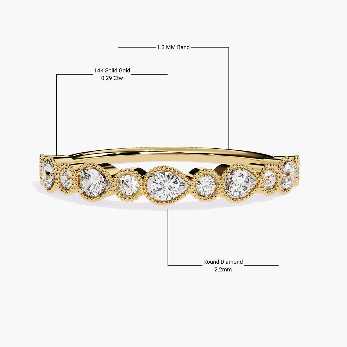 A yellow gold stackable eternity band with alternating pear-shaped and round bezel-set diamonds, each encircled by delicate milgrain detailing. The ring features a 1.3mm shank and 2.2mm round diamonds, totaling 0.29 carats. This elegant and timeless design is perfect for stacking or wearing alone, with a vintage-inspired aesthetic that complements engagement rings beautifully. The precise craftsmanship and sophisticated details make it an ideal addition to any jewelry collection.