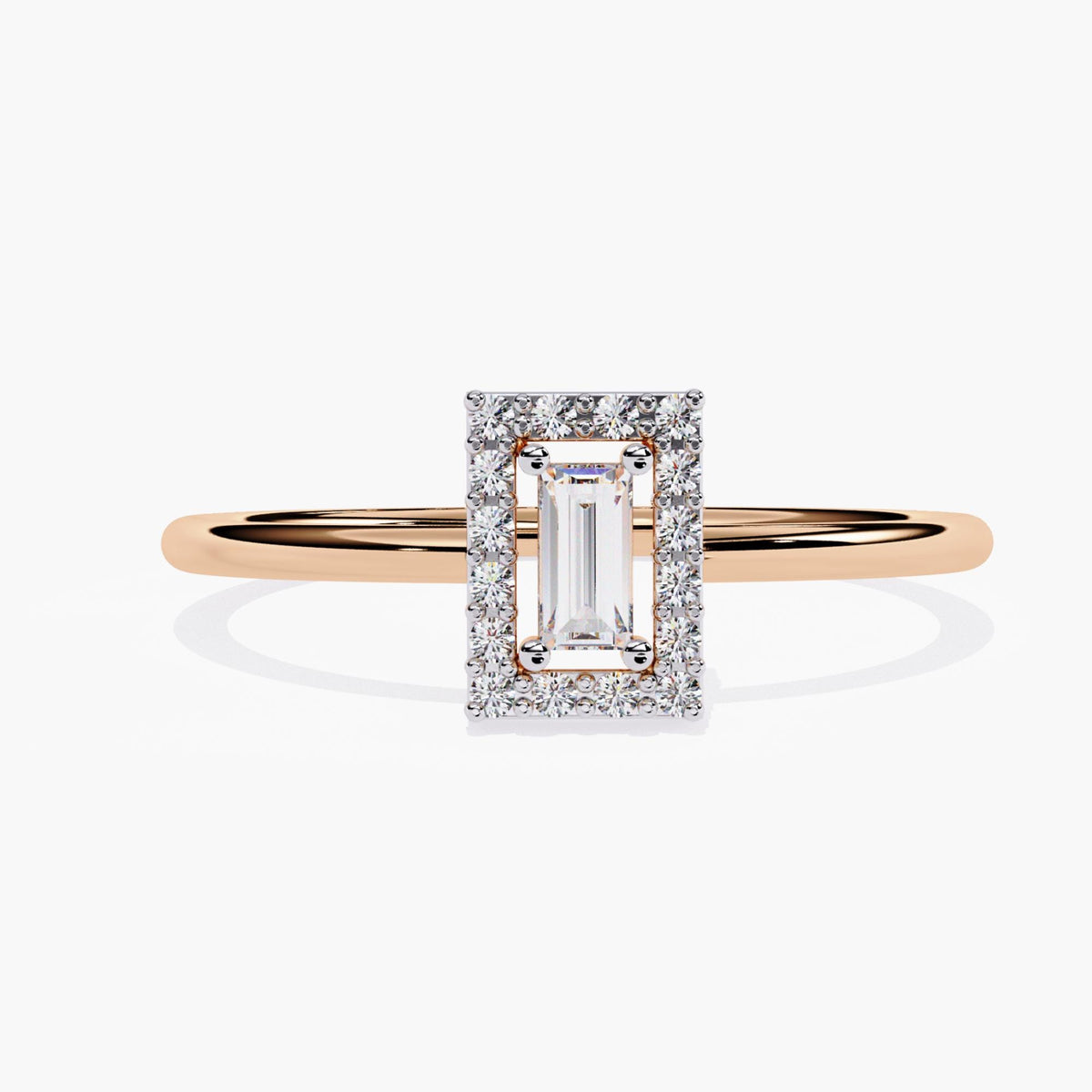 A rose gold ring featuring a rectangular emerald-cut diamond at the center, surrounded by a halo of round brilliant diamonds. The diamond halo enhances the brilliance of the center stone, creating a striking contrast with the smooth, polished band. The sleek design offers a modern yet timeless aesthetic, making this ring a perfect choice for an engagement ring or as a statement piece in any jewelry collection.