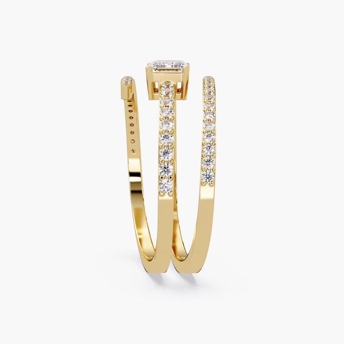 A 14K yellow gold wrap ring with a center emerald cut diamond and three rows of small round diamonds in a bypass setting. The open design wraps around the finger with sparkling pavé-set diamonds on each band. Excellent ring to wear as statement jewelry and on pointer finger