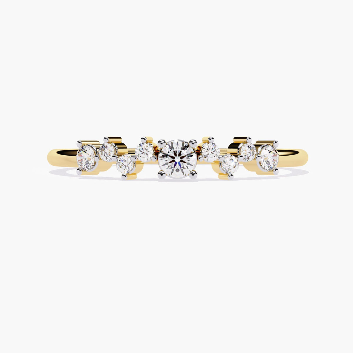 A yellow gold band ring with a cluster of small diamonds and a larger round diamond in the center.